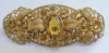 Schöne Brosche wohl böhmischer Modeschmuck Gablonz bersteinfarbene Steine 6x2,5